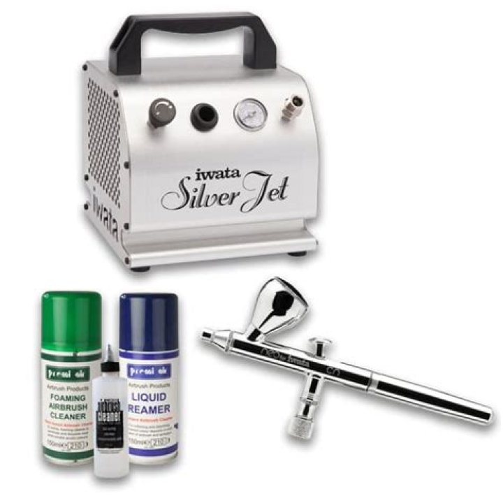 A silver airbrush with a blue compressor.