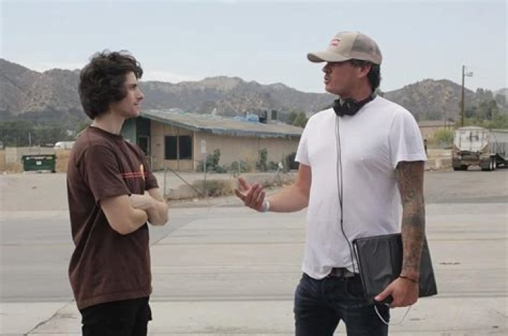 Actor Jack Samson and Tom DeLonge stand in an empty parking lot somewhere in Southern California for Monsters in California