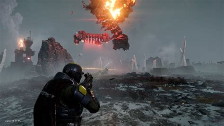 An in-game cutscene from Helldivers 2 showing a Helldiver giving a thumbs-up