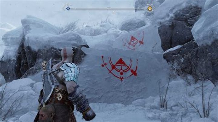 Kratos faces icy cliffs that need to be climbed. The traversal markings that guide him have been transformed from their normal color to bright red, making them easier to notice.